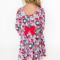 Girl in festive dress with bow and wreath print