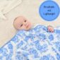 Baby wrapped in blue floral blanket, breathable and lightweight.