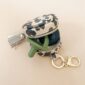 Camo pouch keychain with pacifier holder.