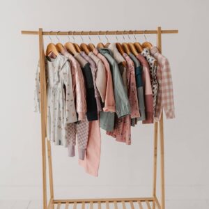 Children's clothing on a wooden rack