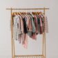 Children's clothing on a wooden rack