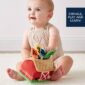 Baby playing with colorful educational toy.