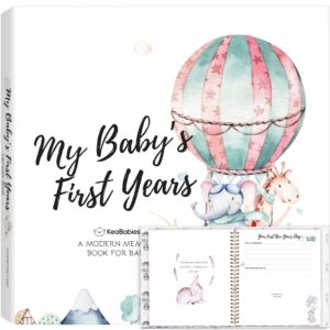 Baby memory book cover and open pages.