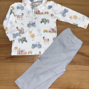 Children's farm-themed pajama set on wooden surface.