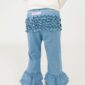 Child wearing blue ruffled pants and white sweater.