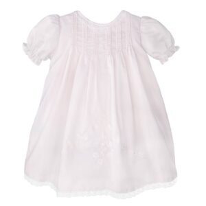 White embroidered baby dress with puff sleeves.