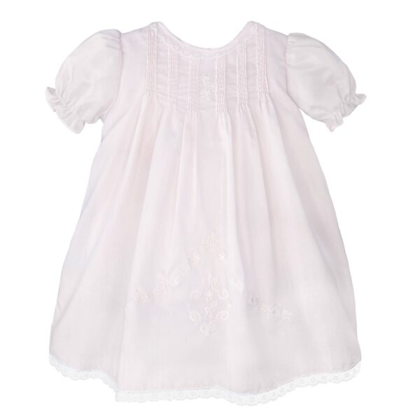 White embroidered baby dress with puff sleeves.