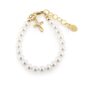 Gold bracelet with pearls and cross charm