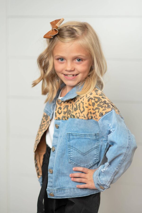 oopsie daisy kids leopard patch & light wash denim button pocket jacket Child smiling in denim jacket with leopard print.