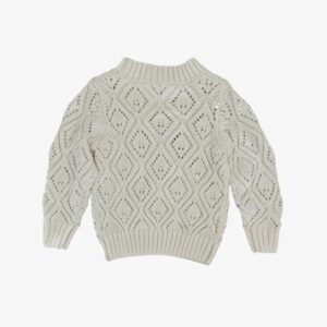 Ivory knit sweater with diamond pattern design.