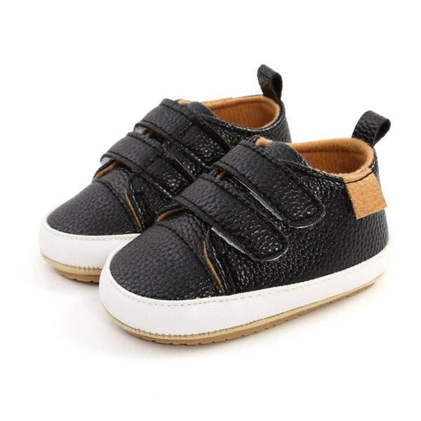 urban tots velcro sneaks black Black baby sneakers with velcro straps.