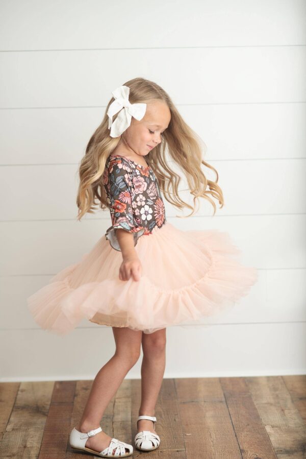oopsie daisy kids brown & peach vintage floral tulle fall dress Girl spinning in floral top and tutu skirt.