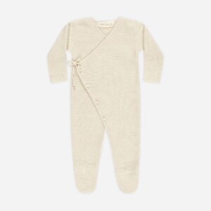 Beige baby romper with button closure