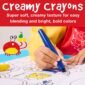 Child coloring with vibrant creamy crayons.