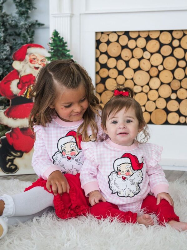 rufflebutts pink gingham santa applique long sleeve shirt Children in Santa shirts by fireplace