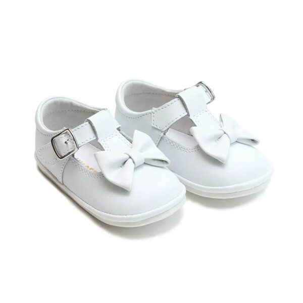 White baby shoes with bow and buckle