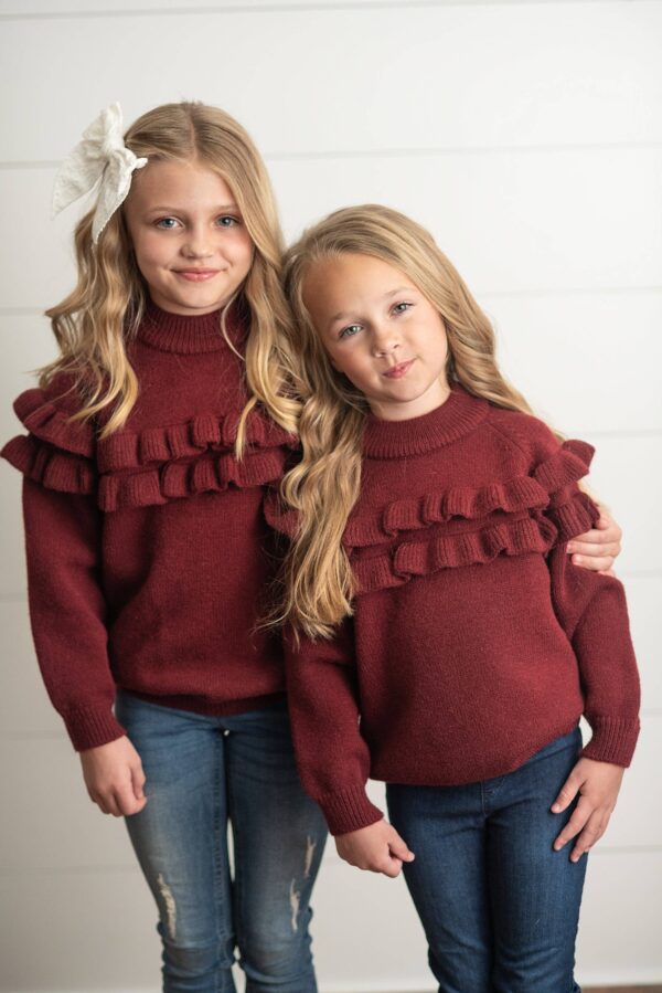 oopsie daisy kids wine double ruffle crew neck fall winter sweater Two girls in matching burgundy sweaters and jeans.