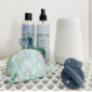 Baby bath products with a pacifier and bag.
