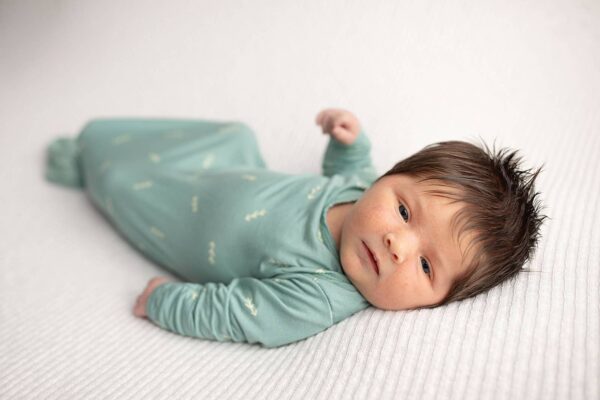 three little tots arrow print knotted newborn baby gown pajamas Newborn baby in green outfit on blanket