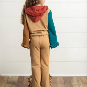 Child with colorful outfit, facing away.