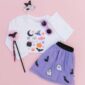 Halloween-themed kids outfit with ghosts and bats.