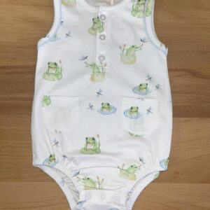 White baby romper with frog print design.