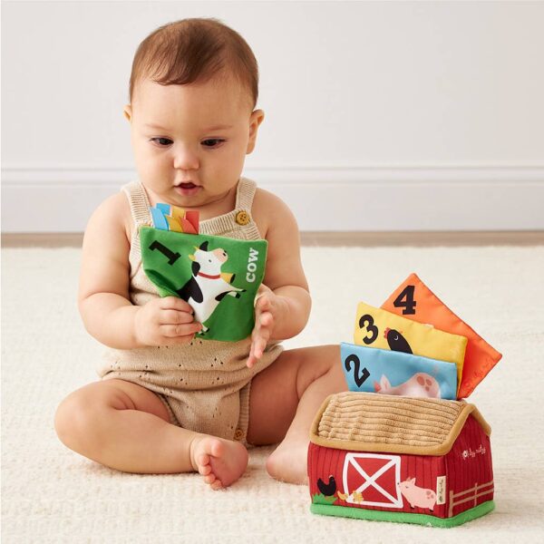 itzy ritzy *new* itzy sensory scarves™ Baby playing with farm-themed learning toy.
