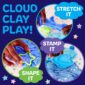 Kids playing with blue cloud clay, shapes, stamps.