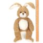 Brown plush bunny toy beside a ruler for size.