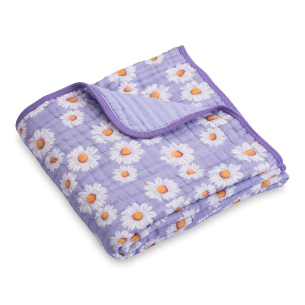 Purple blanket with white daisies folded neatly.