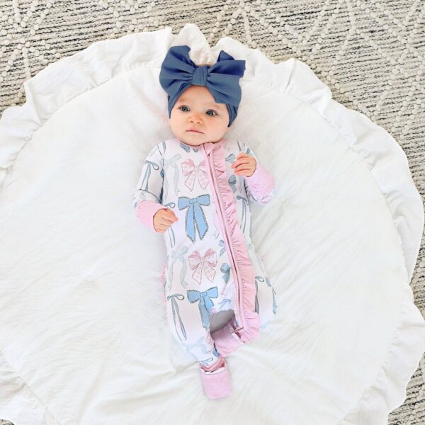 gigi and max samantha bows ruffle zip bamboo sleeplies little outfit Baby in bow outfit on soft rug