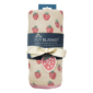 Strawberry-patterned muslin blanket rolled with ribbon.