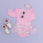 Pink baby outfit with ghost skirt and sneakers.