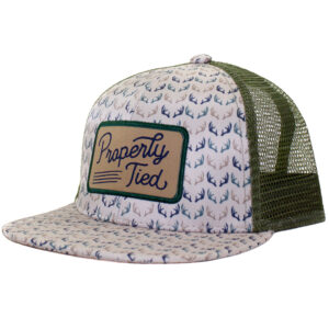 Mesh trucker hat with antler pattern and patch.