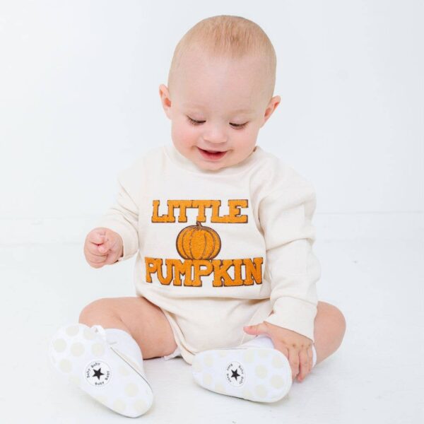 sweet wink little pumpkin patch long sleeve romper unisex Baby wearing 'Little Pumpkin' outfit, smiling.