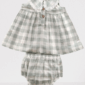 Plaid baby dress with lace collar and bloomers.