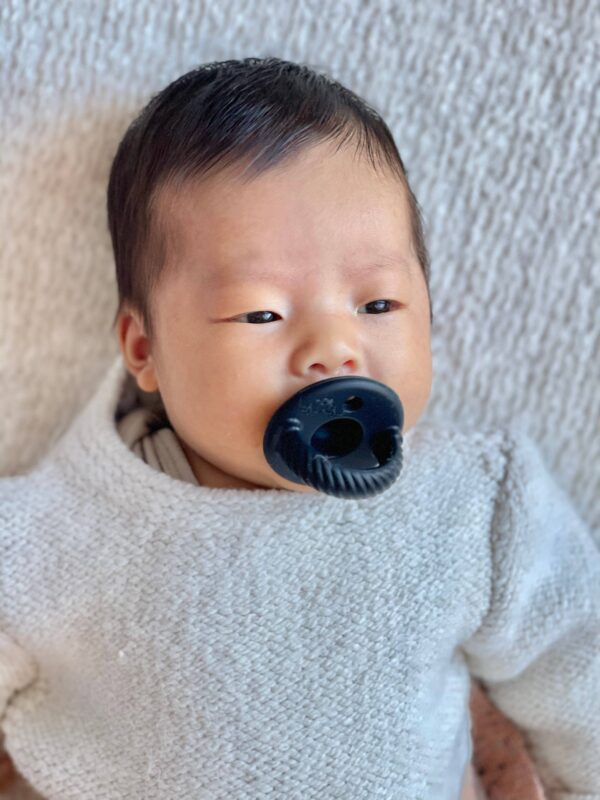 itzy ritzy sweetie soother™ pacifier sets (2 pack): agave + succulent cables Baby with blue pacifier relaxing