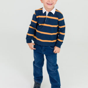 Smiling child in striped shirt and jeans.
