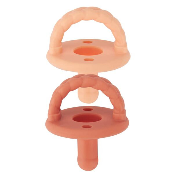 itzy ritzy sweetie soother™ pacifier sets (2 pack): aquamarine + peach bows Two silicone baby teething toys stacked together.