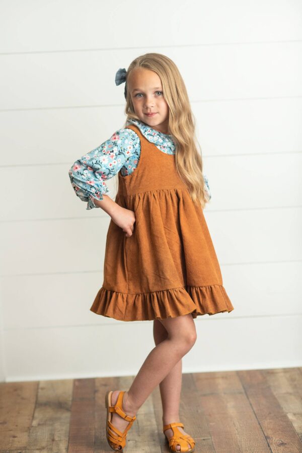 wren & james kids blue floral smocked top & caramel corduroy jumper set Child in blue floral and brown dress posing
