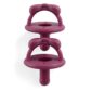 Two purple baby pacifiers with bow designs.