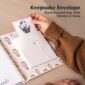 Hand holding envelope with baby handprint card.