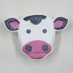 Cartoon cow face with pink snout and ears.