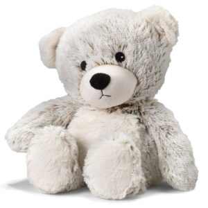 Soft, fluffy teddy bear sitting upright.