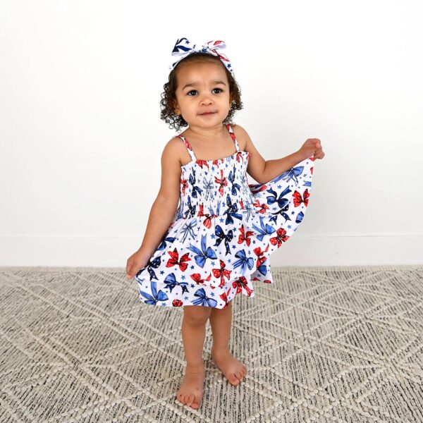 gigi and max eleanor bow clip bow 4th of july hair accessory Toddler in floral dress with matching headband.