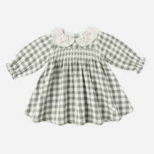 Baby dress with checkered pattern and lace collar.