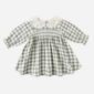 Baby dress with checkered pattern and lace collar.