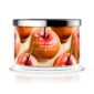 Caramel apple scented candle in glass jar.