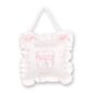 White tooth fairy pillow with pink bows and ruffles.