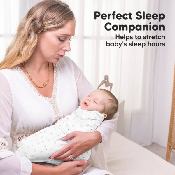 keababies 3pk soothe zippy baby swaddles 0 3 months,newborn sleep sack Woman holding sleeping swaddled baby in white room.